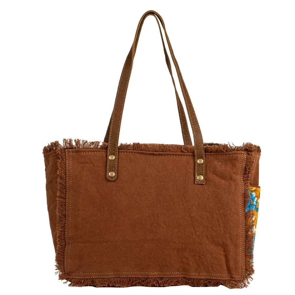 Myra Bag Blue Ridge Blossoms Crossbody: Vibrant Woven Rug, Hand-Tooled Leather, and Frayed Edge Accents