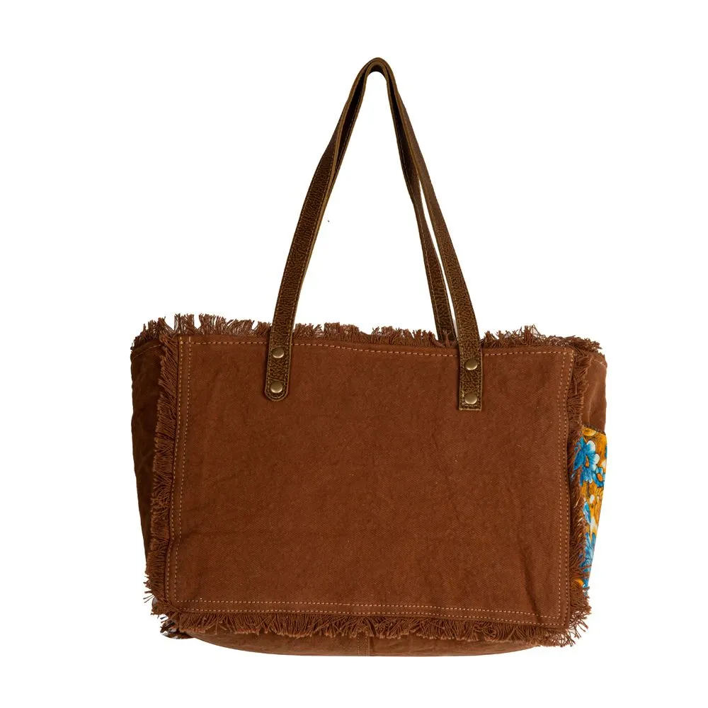Myra Bag Blue Ridge Blossoms Crossbody: Vibrant Woven Rug, Hand-Tooled Leather, and Frayed Edge Accents