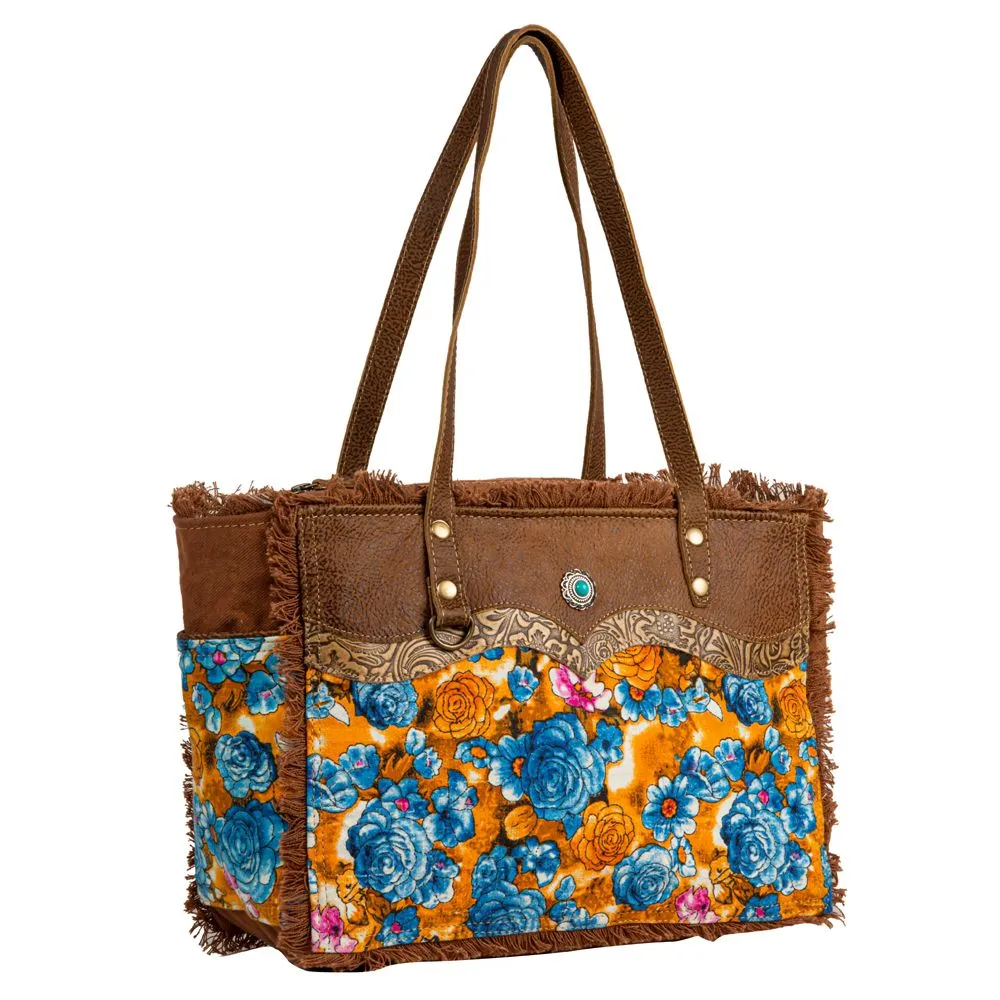 Myra Bag Blue Ridge Blossoms Crossbody: Vibrant Woven Rug, Hand-Tooled Leather, and Frayed Edge Accents